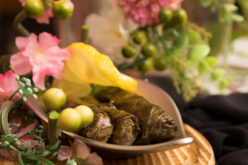 Cooked vine leaves stuffed with rice and Arabic spices