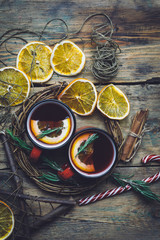 Christmas drink (winter hot drink). Mulled wine punch and spices for glintwine on vintage wooden table background top view.
