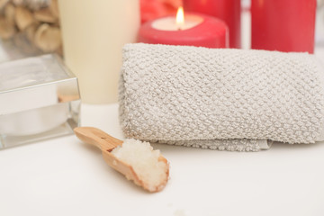 Obraz na płótnie Canvas Spa care - candles, cream, towel. Flat lay, spa concept. 