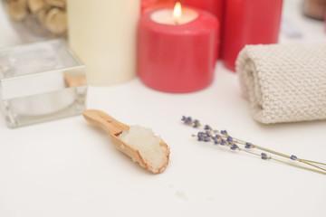 Spa care - candles, cream, towel. Flat lay, spa concept. 