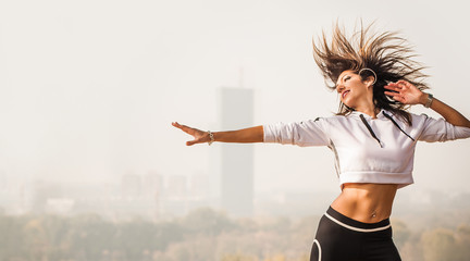 Zumba dance fitness instructor doing sport aerobic exercises. Motivational coach
