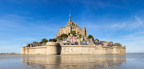 panorama of Mont Saint-Michele castle in France from sea side in low tide time