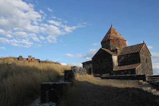 Armenian stone church Sevanavank with blue cloudy sky