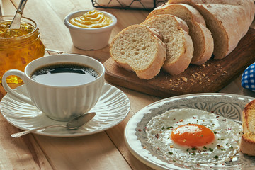breakfast with egg, bread toast and coffe