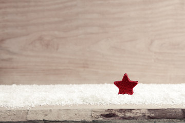 Christmas background with red star and white snow.