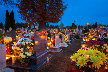 Colorful candles on the cemetery at All Saints Day, Poland