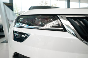 Fototapeta na wymiar The headlamp of a modern prestigious car from a close angle