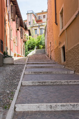 Narrow Verona strees to Castel San Pietro during summer season