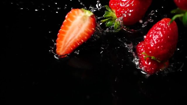 Falling of strawberry. Slow motion.