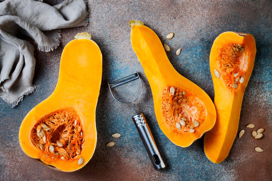 Butternut squash on rustic background. Healthy fall cooking concept