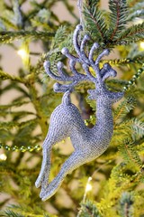 New Year's and Christmas decorations. Christmas deer. Christmas toys, festive mood, a holiday a background, Christmas lights