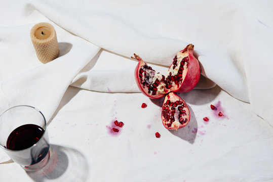 Cut Pomegranate with juiced arils and Persimmon