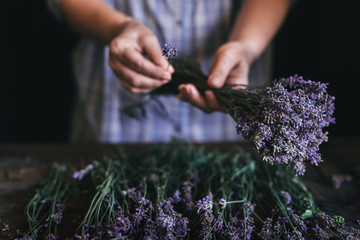 Woman arranging lavender bouquet