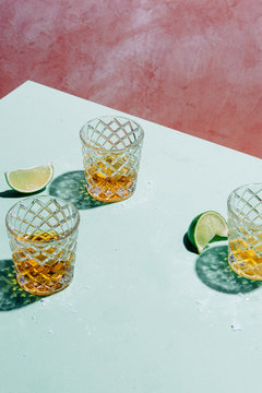 Three tequila shots with lime