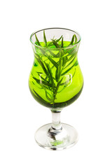 Glass of estragon green lemonade isolated at white background.