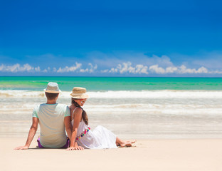 young couple on their honeymoon having fun by tropical beach