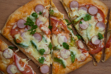 Fresh baked homemade pizza with cheese and tomatoes. Rustic style.