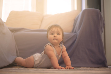 Naklejka premium Baby in living room.