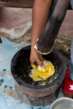 Person using a mortar and pestle