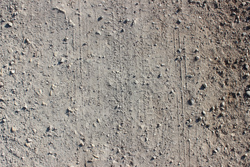 Dirt road tire tracks close up pebbles