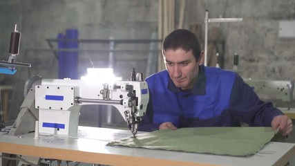 Arab Muslim man at the sewing machine