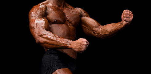 Fototapeta na wymiar athletes bodybuilders are straining biceps side of arm