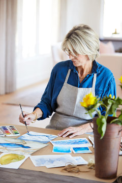 Senior woman doing her watercolor artwork