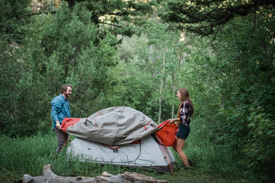 Couple setting up a tent