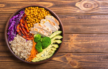 Buddha bowl with avocado , chicken , pepper , quinoa and chickpea