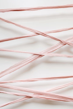 strands of blush colored silk ribbon