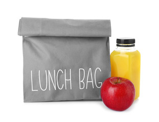 Lunch bag with healthy food for schoolchild on white background