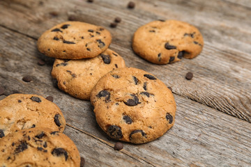 Delicious chocolate chip cookies on wooden table