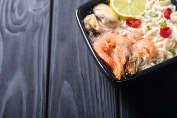 Instant noodles soup with shrimps and mssels . Asian food