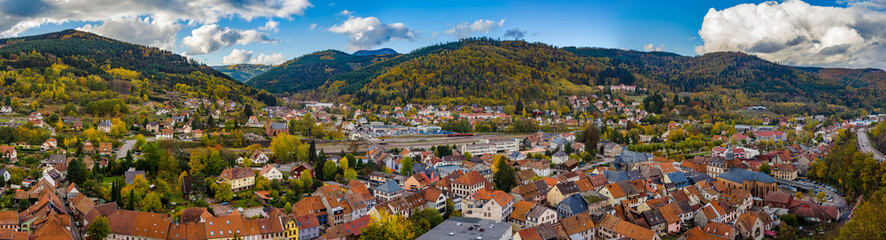 Fototapeta na wymiar Autumnal panorammic aerial view of city Schirmeck in Alsace
