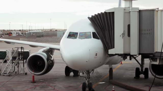 An airplane sits at the gate ready to load and unload passengers.