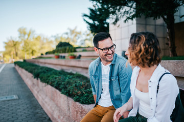 Fototapeta premium Dating concept. Two young people talking outdoors.