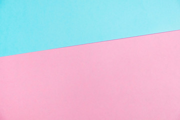 Pastel colored paper flat lay top view, background texture, pink and blue.
