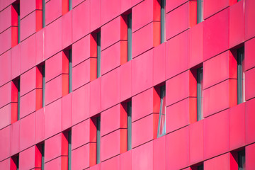Closeup of red building office with lots of  pattern background Windows