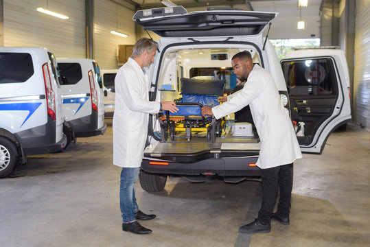 Paramedics preparing ambulance