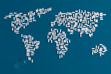 Fototapeta na wymiar Background of scattered on a plain blue background of many tablets in the form of a silhouette of the continents of the world 3d illustration