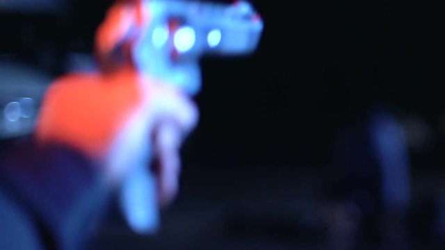 Policeman holding at gunpoint offenders beating innocent person, bullying, crime