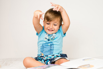 little boy with book