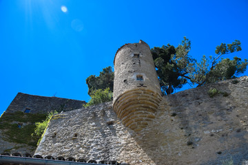 Remnants of the old city walls and turrets of Menerbes, in the Luberon area of Provence, France