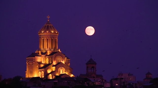 Bird flying and moon rise and this beautiful church give me a good feeling.