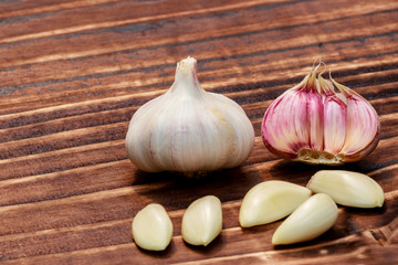 close up on garlic over dark wood