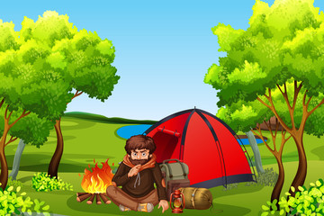 Young mancamping in forest