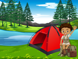 A boy camping in forest