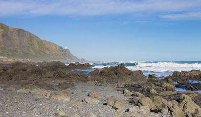 landscape image of the rocky coastal terrain of Cape Palliser, New Zealand.