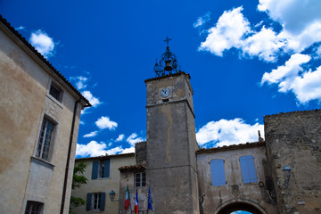 Bell tower of the town hall of the medieval village of Menerbes in the Luberon area of Provence, France