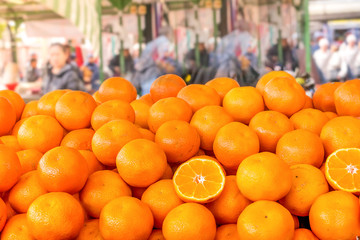 Closeup of row of oranges fruit in the grocery market in morning time, eating healthy food